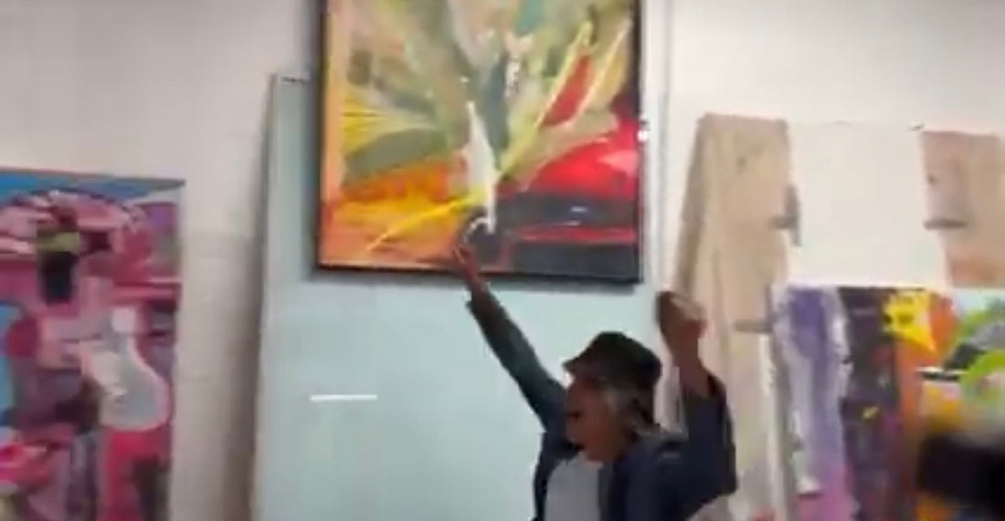 Kevin dancing in his  Toronto art studio